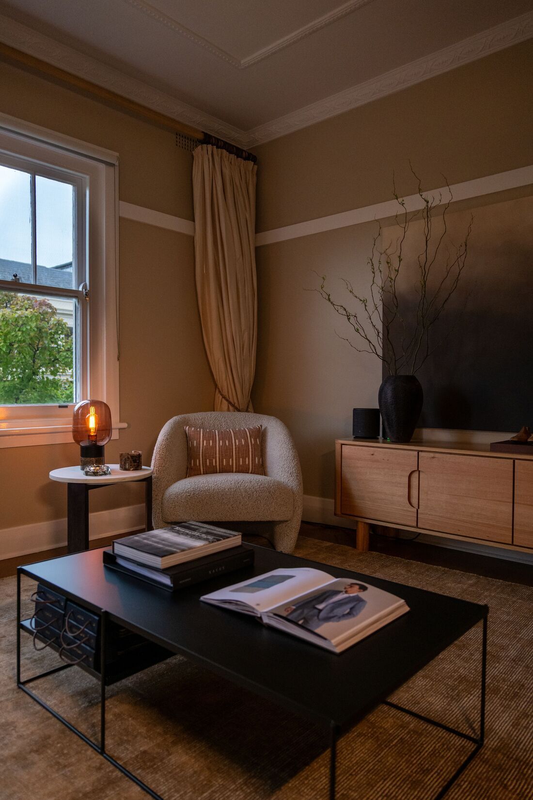 a dimly-lit & cozy showroom with a catalogue on the table